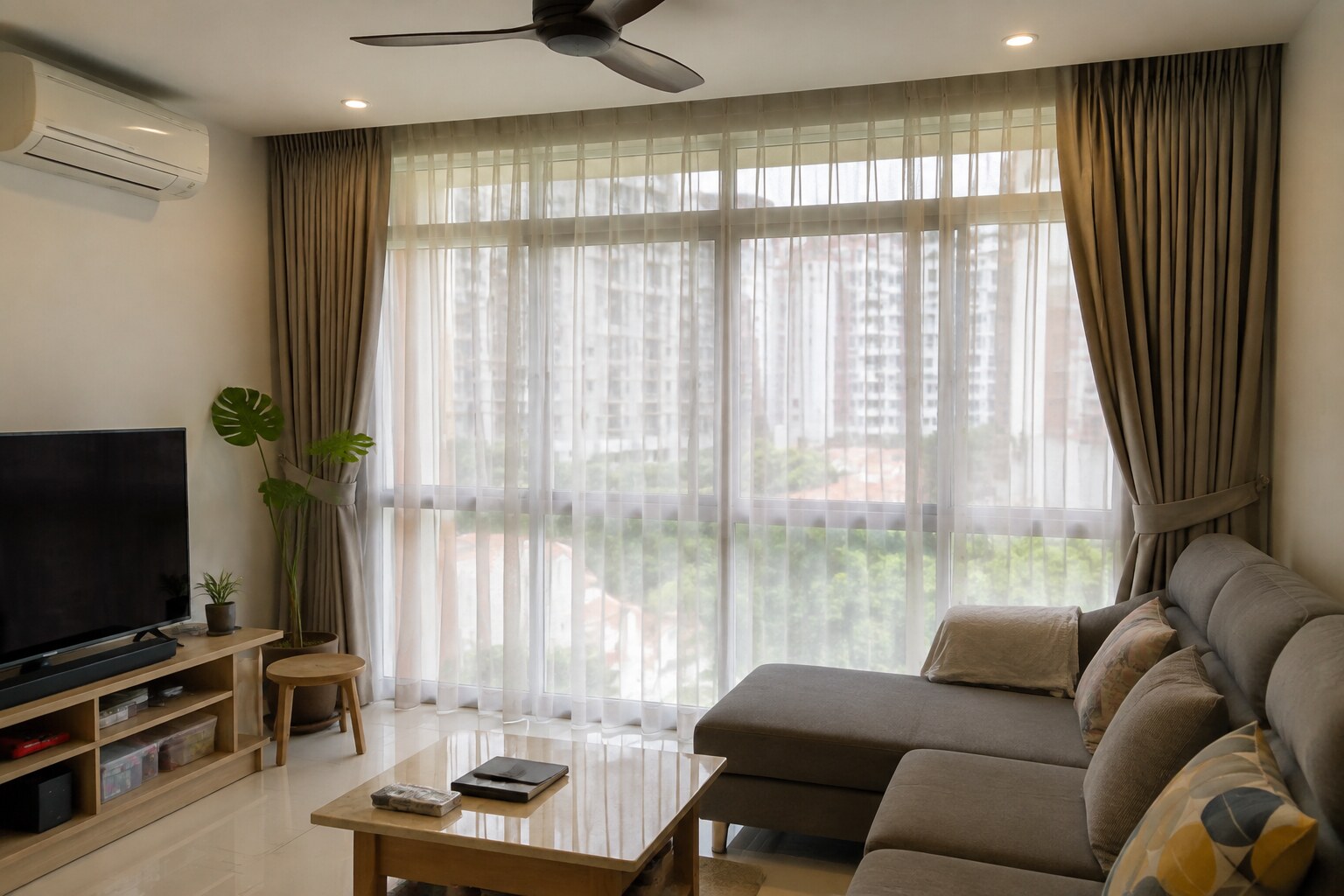 Layered sheer and denser curtains framing a residential window