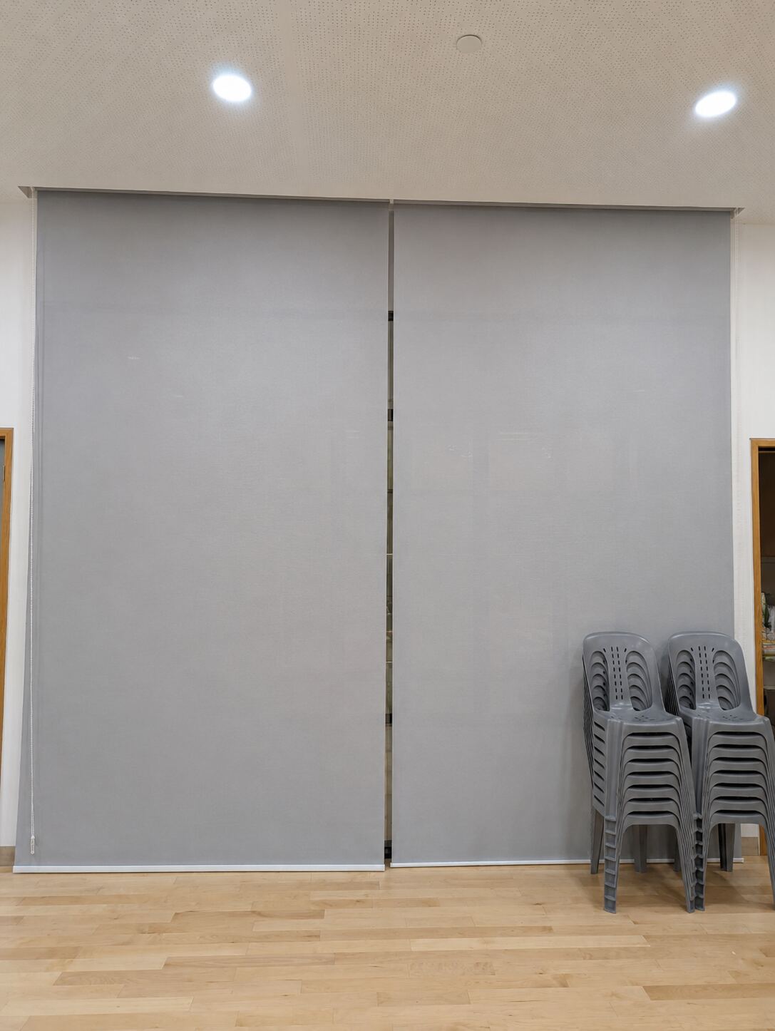 Commercial room with full-height roller blinds