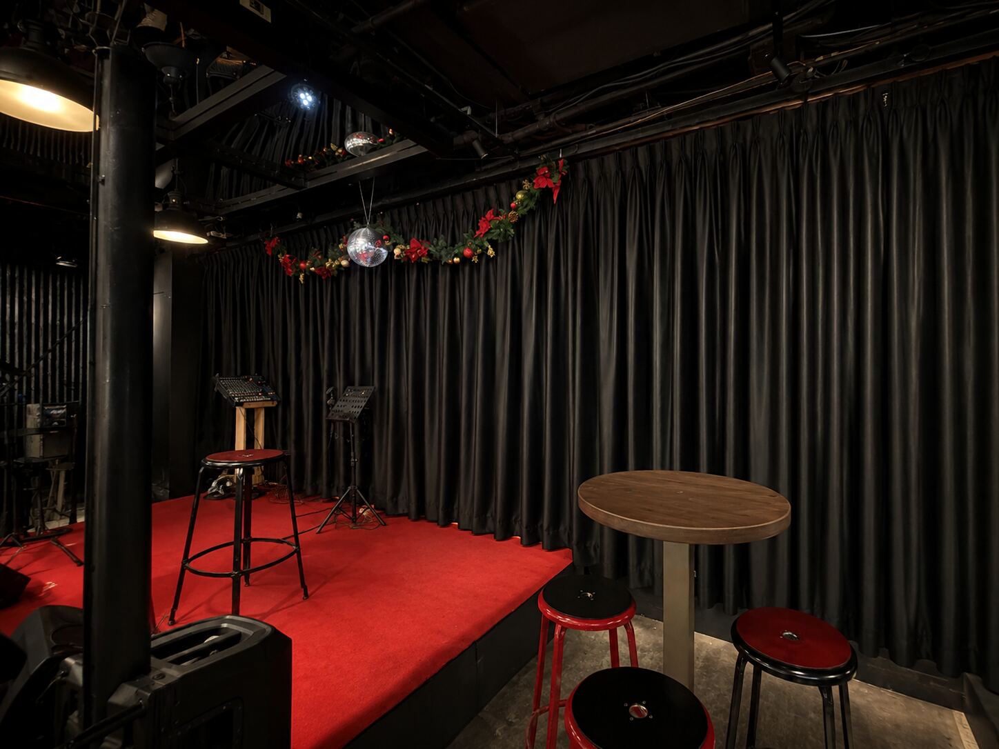 Commercial performance space with black stage curtains