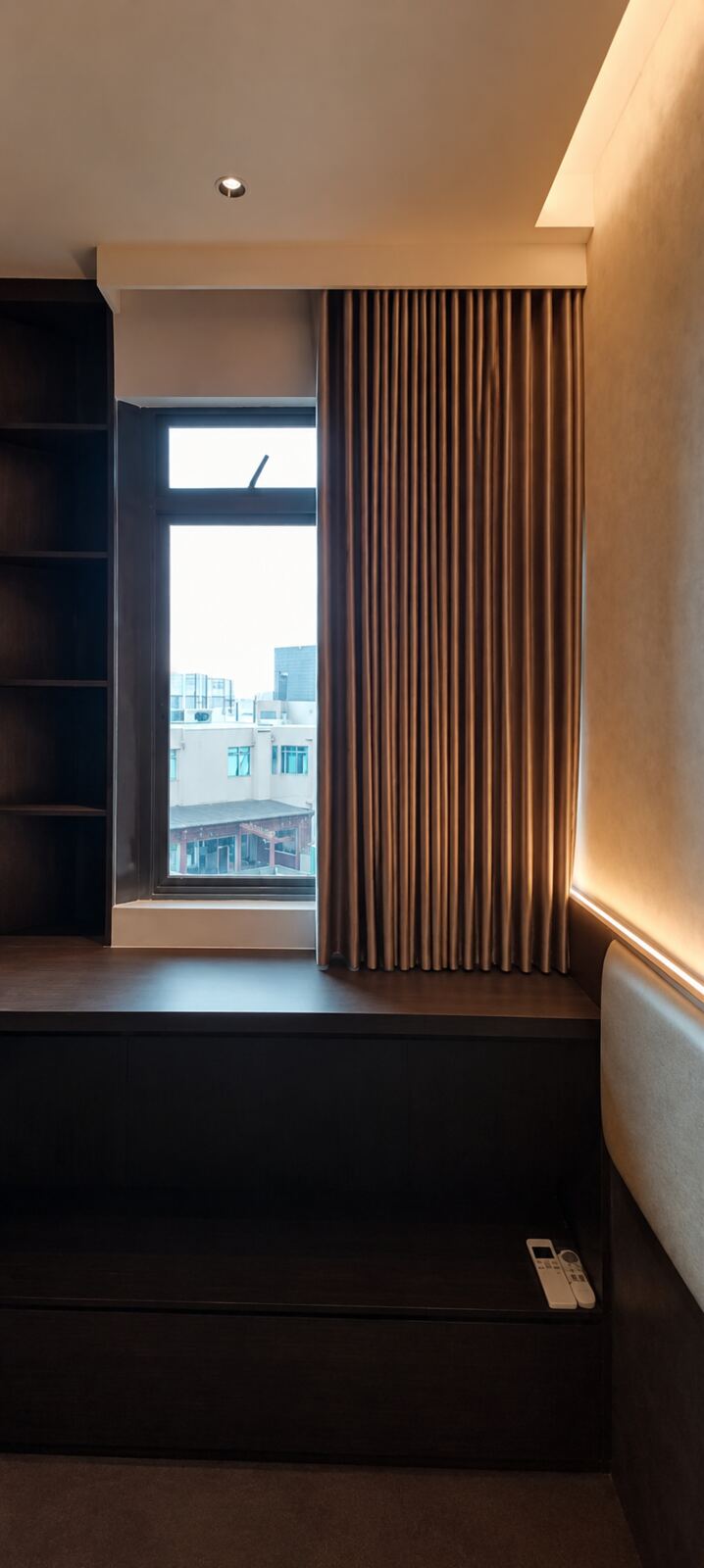 Condominium study with full-height curtains