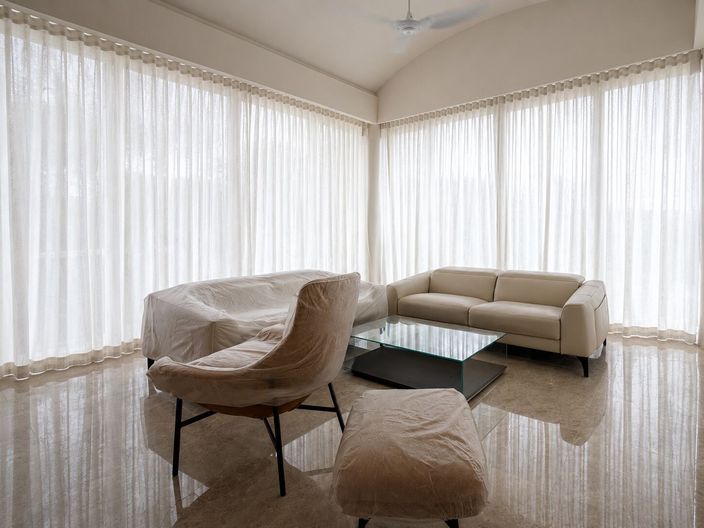Landed home living room with full-height sheer curtains